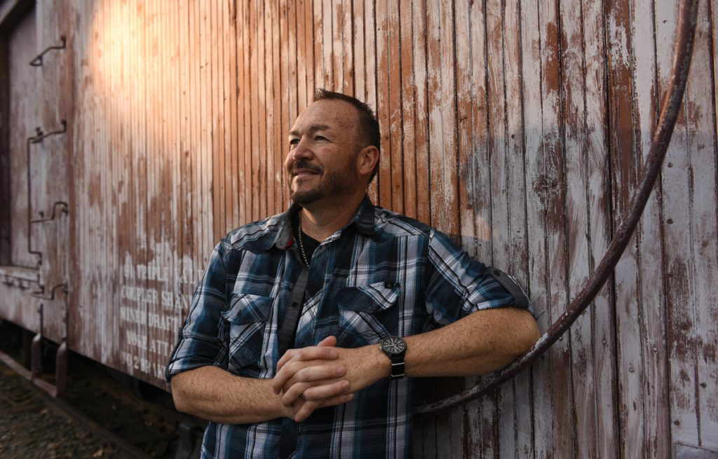 Portrait of Stephen Mullen, a train engineer who coped with a brain tumor that threatened his hearing.