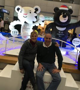 Joy Anderson, a physical therapist who is headed to the Olympics in South Korea. Sitting next to her is a man who is the skaters' team doctor.