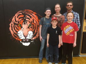 Marcy and Kurt Brossman with their children, Makayla, Kenzie and Kooper at the Cheyenne Wells School.