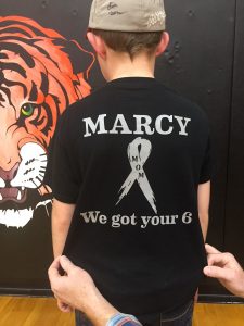 Kooper Brossman, 9, wears a T-shirt showing support for his mother, Marcy Brossman, who is fighting brain cancer and leukemia.