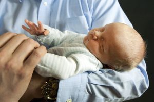 Cancer success then a new baby. Beckett Leffler in his dad's arms.