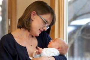 Jennifer Leffler holds her baby as he gazes up at her.