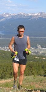 Patrick Gaines runs with mountains in the background. He does ultra-marathons in Colorado and around the world. Running and other alternatives to opioids help him cope with pain.