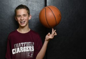 Parker Teff spins a basketball on his left finger. He was born with cerebral palsy, but stays loose and healthy through sports.