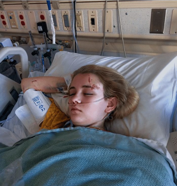 A photo of London Lyle sleeping in a hospital bed.