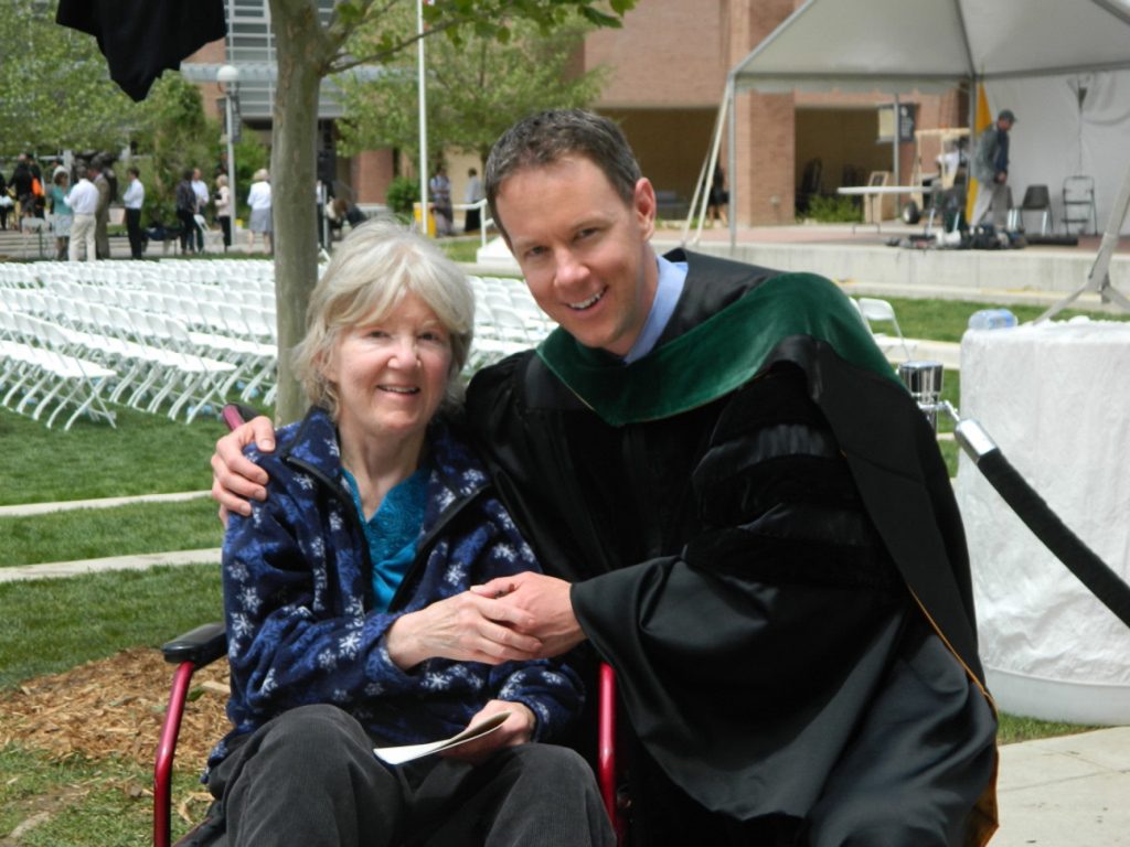 Dr. Jeffrey Lewis poses at his medical school graduation with his mom, Dr. Jeanne Lewis. She was a hometown doctor in Boulder. Now he's following in her footsteps.