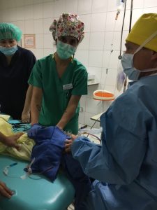 Drea Mogenson, a nurse with UCHealth Medical Center of the Rockies, shown in the Philippines helping with a surgery for Mending Faces, a nonprofit group that helps kids with cleft lips and cleft palates.