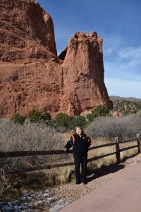 Linda Regis is pictured in front of a red rock in Garden of the Gods Park.