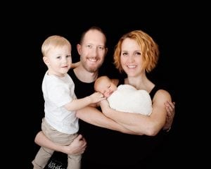 Photo of mom, dad, toddler and baby. Photos by Organic Bebe Photography