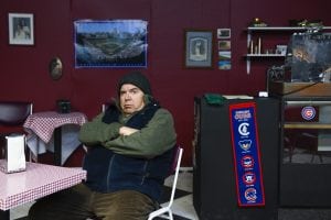 Greg West sits on stage dressed as "Max" an angry Russian business owner in the play, Superior Donuts. He had to have an LVAD and a heart transplant and is now back on stage.