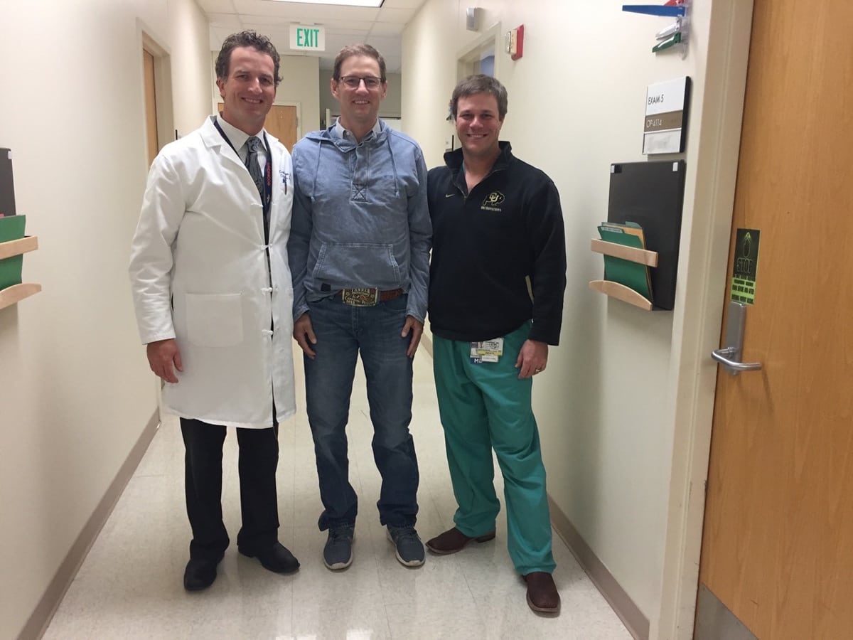 Archie Chant, center, with two of his doctors, Craig Hogan, left, and Jason Stoneback, right.
