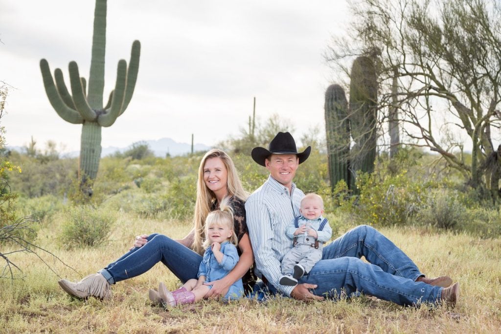Archie and Lesa Chant pose in Arizona near Saguaro cactus with their daughter, Charli, and their son, Hudson. The family was in a terrible head-on crash. Archie survived and is riding, roping and ranching again.