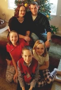Erin Hirmke, top left, with her three kids and her fiancee Nic Dinmore . the Mindfulness-Based Childbirth and Parenting has helped them be better parents.