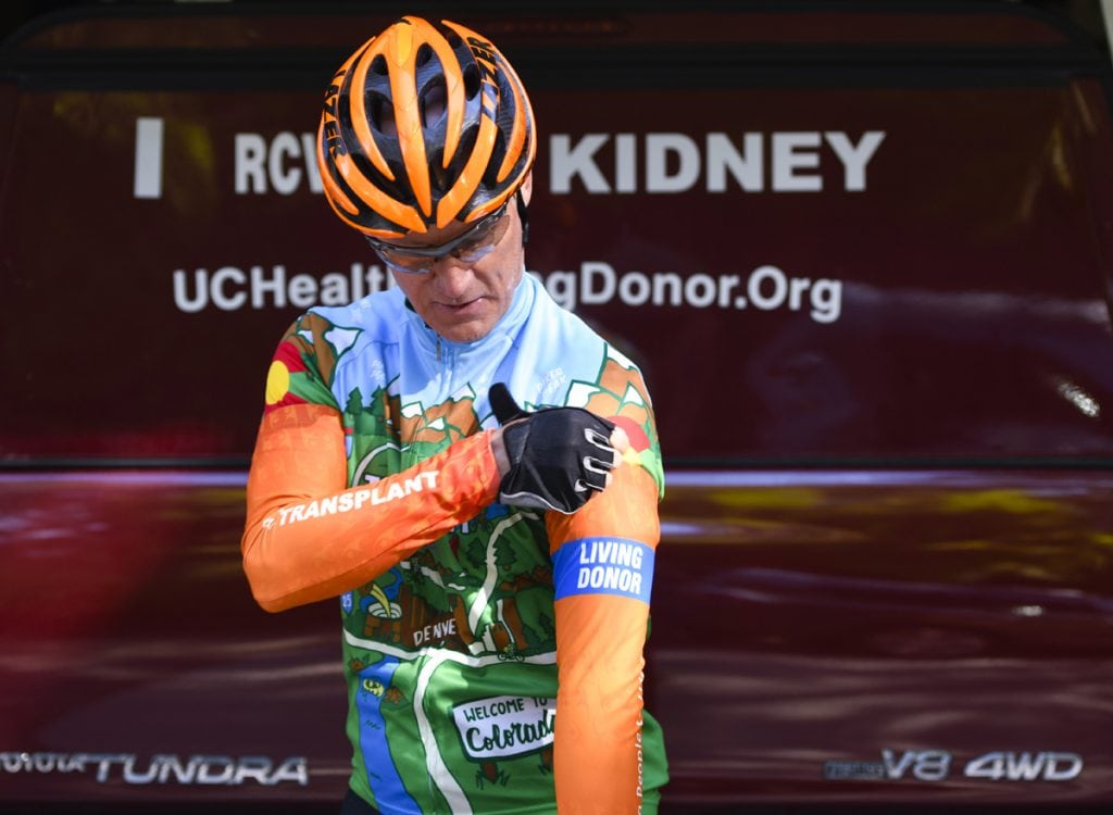 Scott La Point poses in a bike shirt especially made for living organ donors. Photo by Cyrus McCrimmon for UCHealth