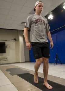 Reflectors on Hammond’s ankles and feet are tracked by eight cameras mounted high on the UCHealth Foot and Ankle Center’s clinical motion and performance laboratory walls as he walks across force plates, part of a complex mix of technologies that combine to help diagnose problems related to and emanating from the feet.