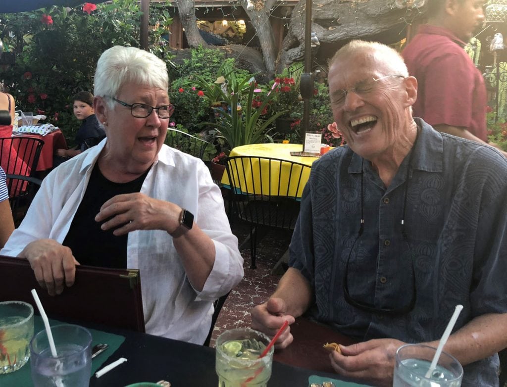 Bill Brennan with his wife of 56 years. Both are laughing after Bill has serenaded his wife.