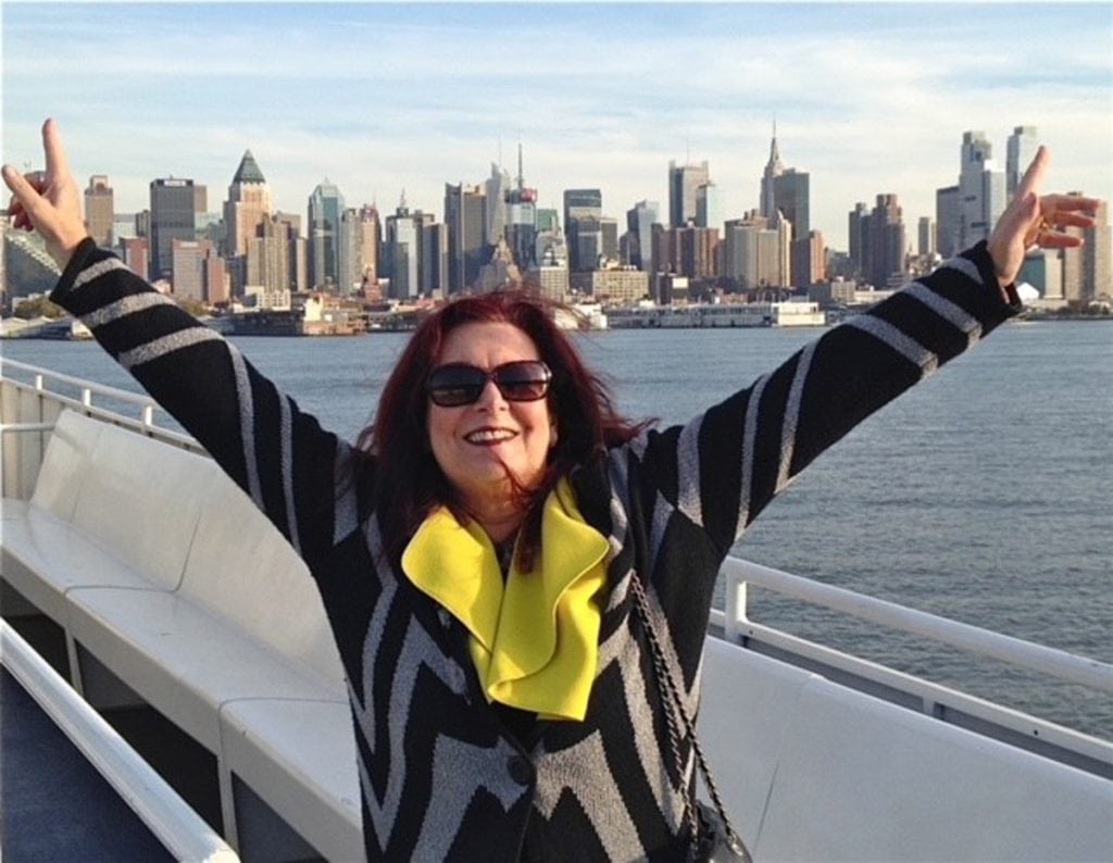 Photo of Barbara Hope-Gaiti, patient with undiagnosed cutaneous lymphoma, with New York City skyline in the background.