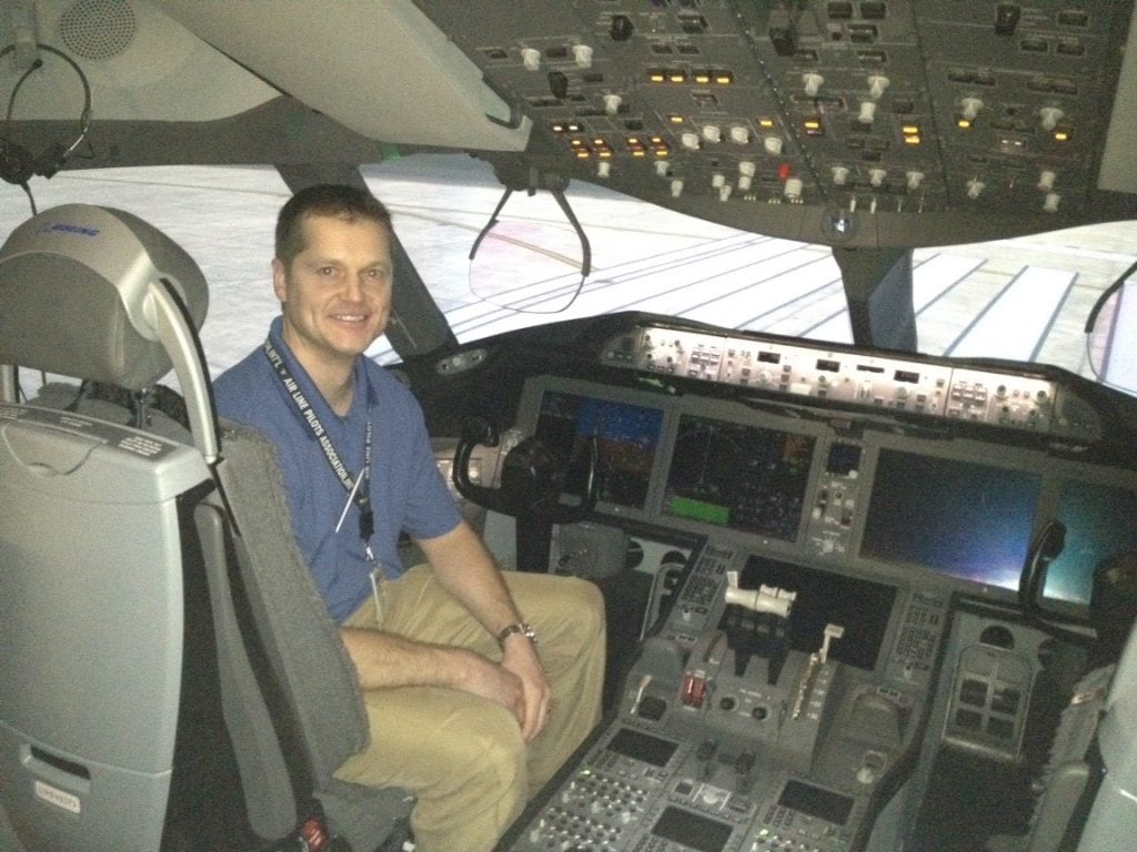 Brian Malek sits in the cockpit of a Boeing 787. Malek's spinal fusion surgery in Steamboat Springs was successful and he would recovery from his spinal cord injury..