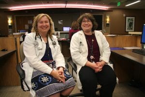 A photo of two advanced practice nurses