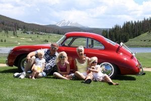 Jerry and Arnette Schouten in Keystone in 2009, with granddaughters (from left) Adleigh, Alexa and Ashlynne. Jerry had recently restored the red Porsche 356. (Courtesy April Hagestad)