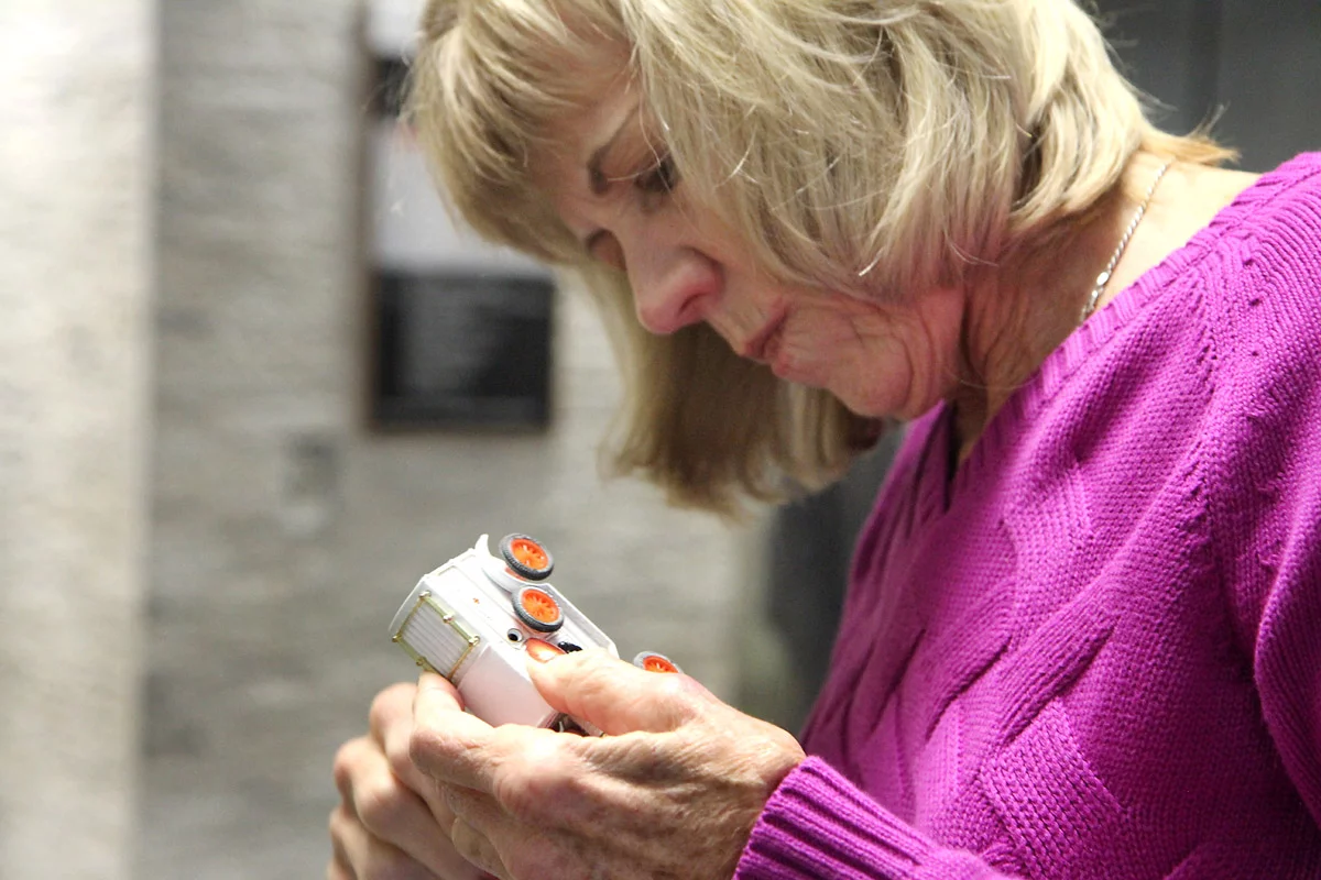 Kathy looks at white ambulance