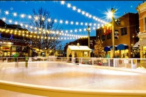 Christmas lights are strung across an empty ice rink in Old Town Fort Collins, one of the top outdoor skating spots..