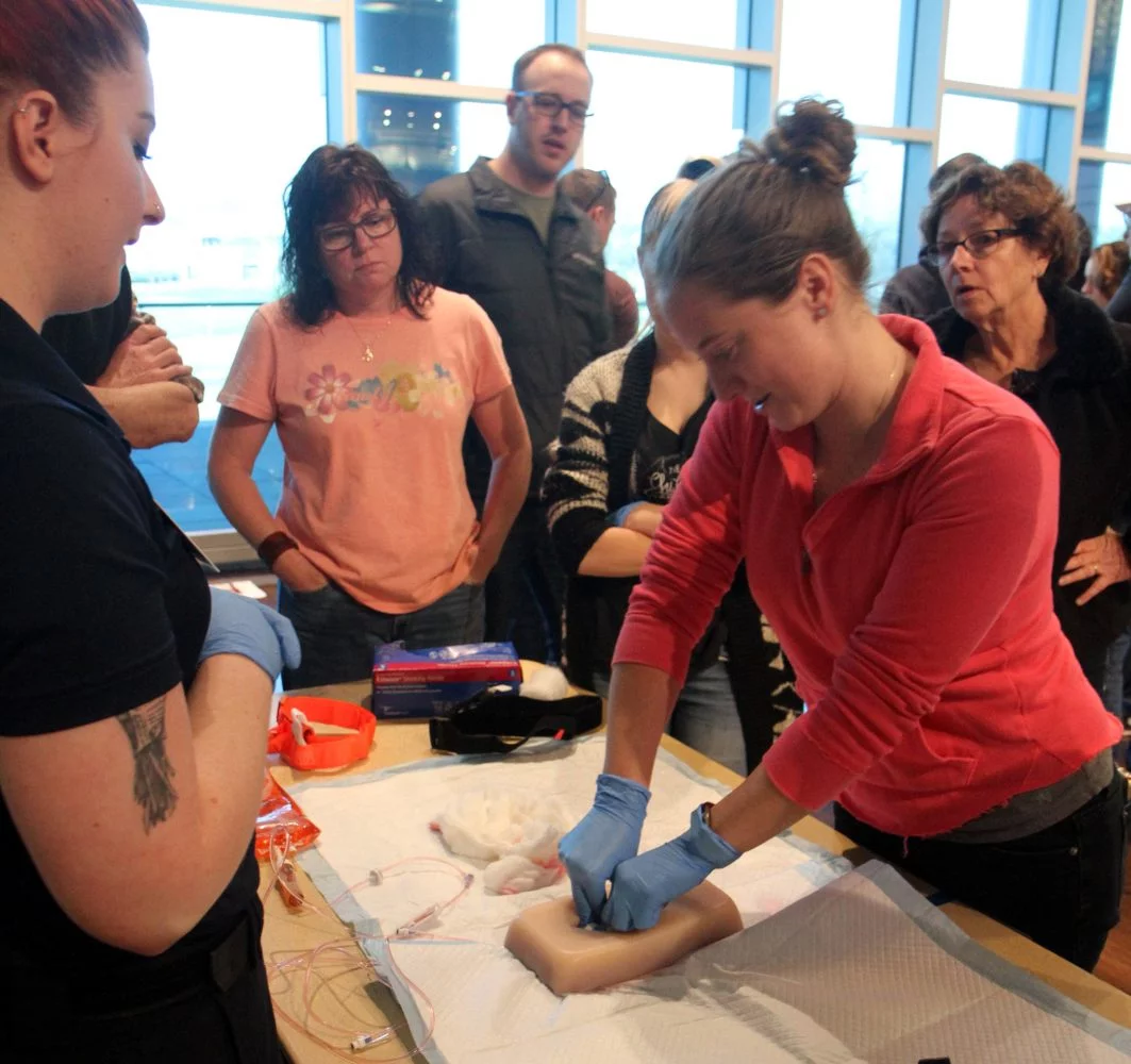 women packs a fake wound.
