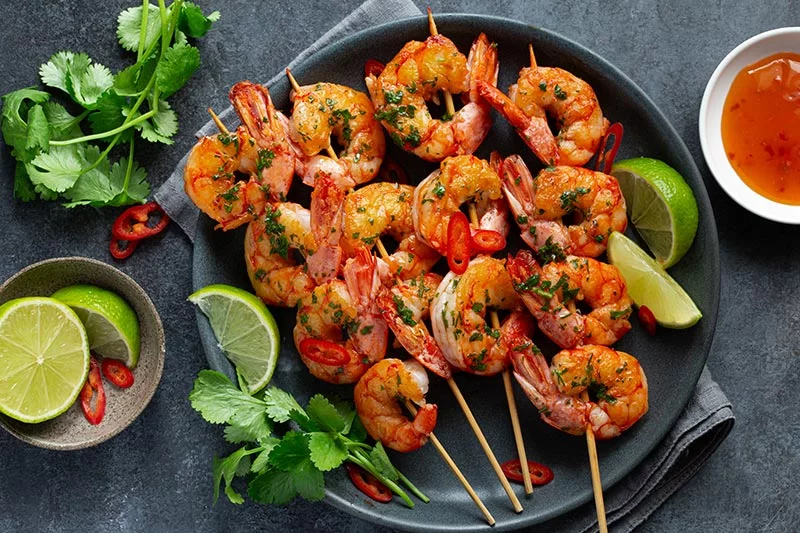 Looking to mix it up a bit and try something in the kitchen that doesn't involve chicken? Try shrimp, lobster or scallops. Photo: Getty Images.