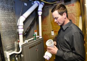 Paul Schreder and Faith Vigiil always assumed their furnace was safe becase their home is relatively new. But the furnace may not have been installed correctly. Faulty venting filled the couple's home with dangerous levels of carbon monoxide gas Photo by Cyrus McCrimmon for UCHealth.