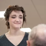 daughter looks at her father