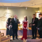 father talks during wedding