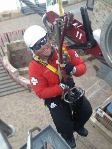 Chris Welch is in a harness connected to the gondola line during a training exercise.