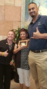 Sara Millard (a kidney transplant recipient) poses with Ruth Sena, her donor's mom and former Denver Bronco, Ryan Harris.