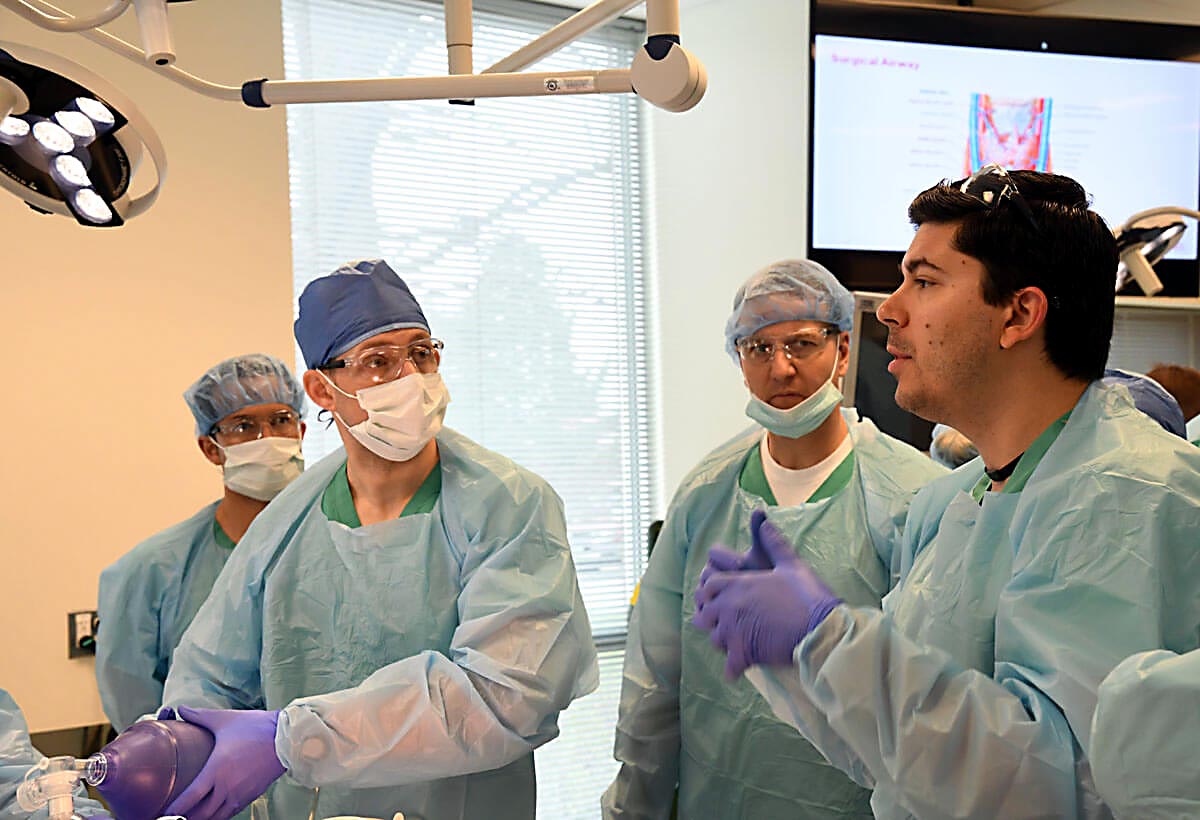 FBI man talking to others in operating room