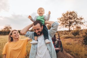 A family walks outside in springtime.