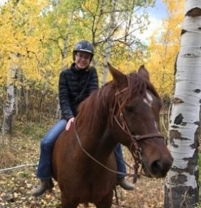 Kristina Mitchell rides her horse, Jazz.