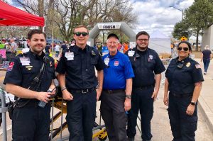first responders standing at finish line the day of the race