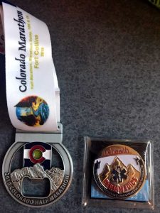 Colorado Marathon medal next to the UCHealth Paramedic coin