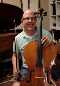 Michael Rector poses with his cello.