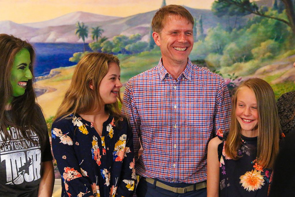 This is a photo of Todd Danielson, daughters Harper and Finely, and the actress who played Elphaba in the production of Wicked.