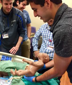 student delivers a fake baby during his CSU biomedical engineering program.