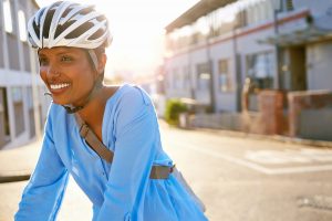 women with bike helmet in the city