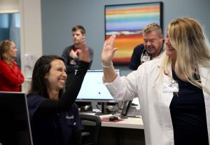 two nurses high-fiving