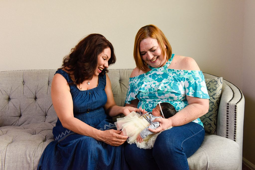 Two grandmas celebrate a new baby.