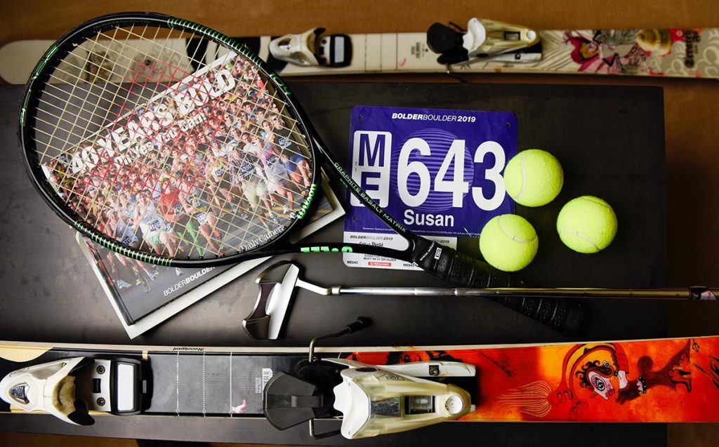 Susan High loves a variety of sports from skiing to tennis to running. A collage shows some of her sports equipment.