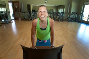 women does yoga pose on chair to overcome cancer related fatigue