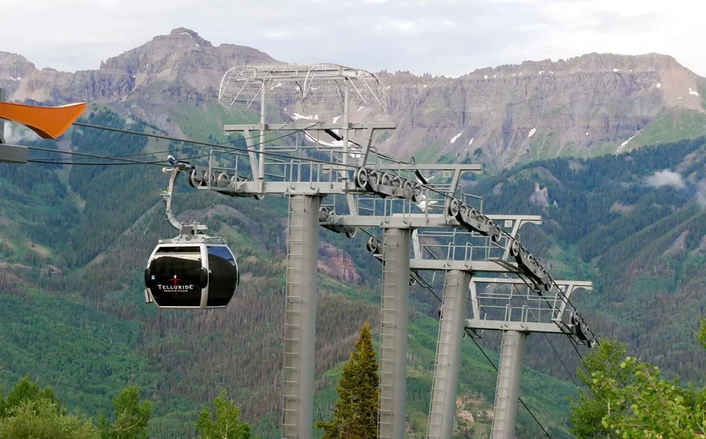 Free gondolas in Colorado include the Telluride gondola here with a view of peaks in the background