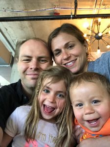 Emily Daniels, who is living with lung cancer, enjoys a happy moment with her husband and their children.