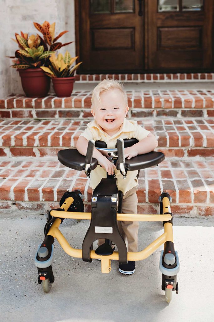 Despite heart problems, Hudson is ready to be a poster boy. Here, he practices standing in his trainer.