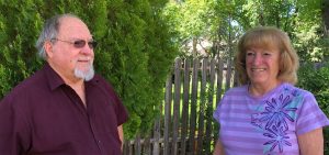 Gary Hall and his wife, Nancy Hall, in the back yard of their Pueblo home.